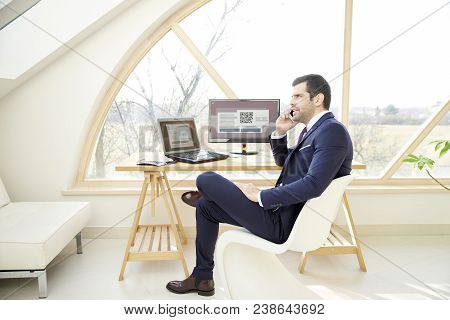 Executive Businessman Talking On His Cell Phone