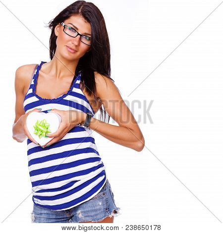 Portrait Of Sexy Brunet Posing In Studio With A Present
