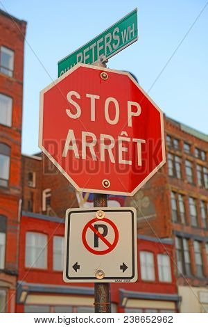 Double Language Stop Sign French Arret In Downtown Saint John, New Brunswick, Canada.