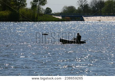 The Portwoman Wears The Groundbait And The Bait Boat Is In The Background