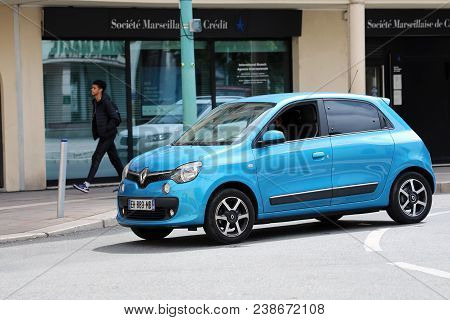 Menton, France - April 5, 2018: Woman Driving A Blue French Small Car Renault Twingo 3 In The City C
