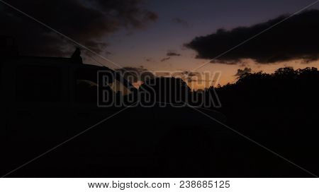 Sunset Over The Bonnet Of A Work Ute.