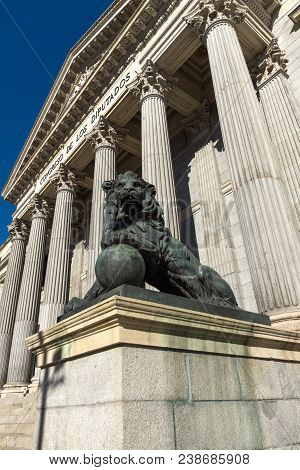 Madrid, Spain - January 22, 2018: Lion Sculpture In Front Of Building Of Congress Of Deputies (congr