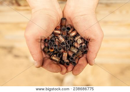 Cases From The Military Cartridges In The Hands Of The Men Of War Concept