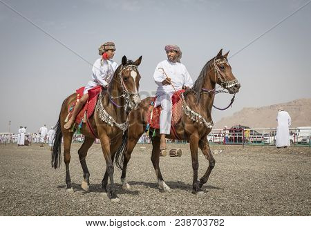 Father And Son Riding Horses