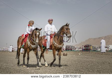 Father And Son Riding Horses