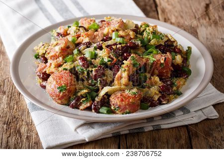 Serving Of Red Beans With Greens, Sausages, Bacon And Eggs Close-up On A Plate. Horizontal