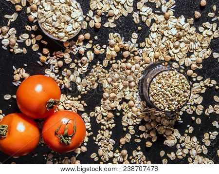 Healthy Diet Raw Cereals On The Black Table Oatmeal