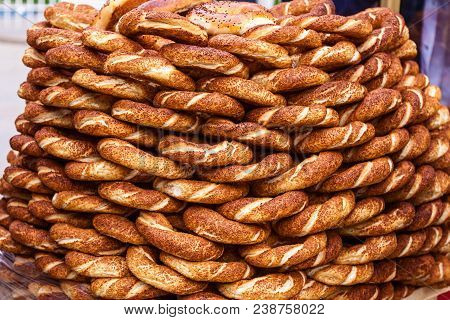 Load Of Crispy Sesame Simits Seen At A Street Vendor Istanbul, Turkey. Turkish Bagel As A Background