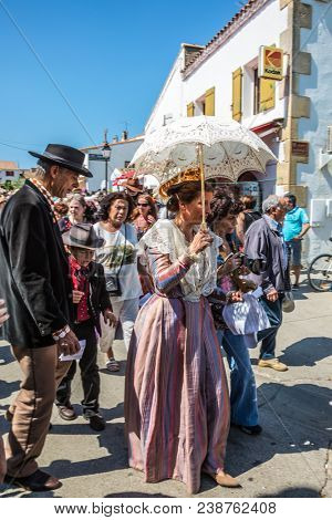 Saintes-Maries-de-la-Mer, Provence, France - May 25, 2015. The concept of ethnographic tourism. Religious feast in honor of the Holy Maries. Residents of the city in beautiful ancient dresses
