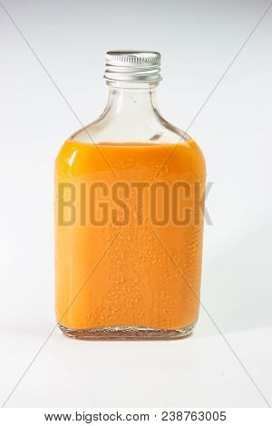 Milk Tea In Glass Bottle On White Background