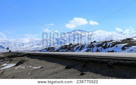 A Roadway Along Mount Ararat With Clear Blue Sky In Turkey