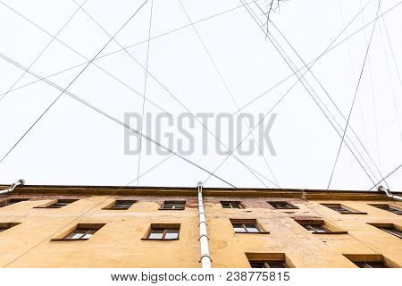 Bottom View Of Many Electrical Wires And Cables Over Urban House In Saint Petersburg City In Saint P
