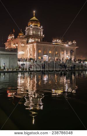 View Of One Of The Main Sikh Shrines Of Delhi - Gurudwara Bangla Sahib In The Night. The Main Buildi