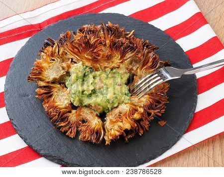 Fried Sliced Artichokes	 - Alcachofas Fritas

Artichoke Slices Deep Fried In Olive Oil. Tasty Vegan 