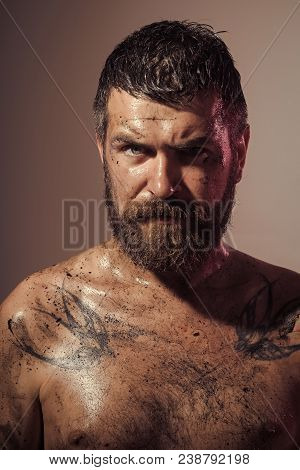 Bearded Man With Tattoo On Chest Skin. Hipster With Beard, Mustache On Dirty Face. Wizard, Sorcerer,