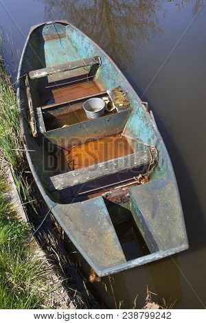 Old Metal Rusty Rowing Boat Seen From Above In The Netherlands
