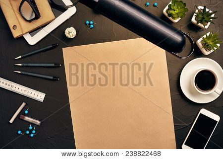 Engineer's Desk In Office With Various Gadgets And Documents
