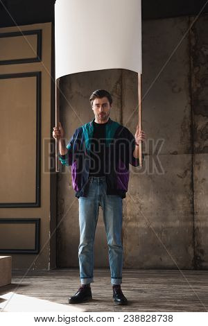 Stylish Young Man In Vintage Windcheater With Blank Placard