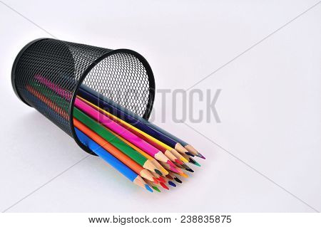 Pencils In A Glass On A White Background