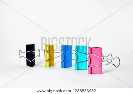 Clips For Paper Standing Vertically On A White Background, Clouse Up
