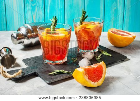 Grapefruit And Rosemary Gin Cocktail, Refreshing Drink With Ice.
