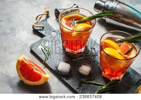 Grapefruit And Rosemary Gin Cocktail, Refreshing Drink With Ice.