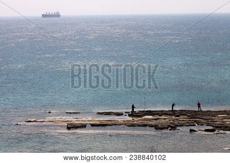Fishermen Are Fishing On The One Of Coast Bozcaada Island