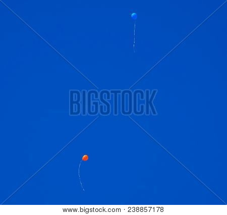Multicolored Balls, Filled With Helium, Fly In The Blue Sky.