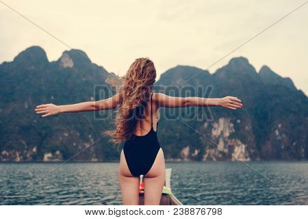 Beautiful woman posing at sunset