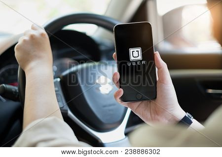 Chiang Mai,thailand - March 01, 2018 : A Uber Driver Hand Holding Uber App Showing On Iphone 6S On R
