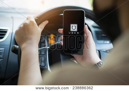 Chiang Mai,thailand - March 01, 2018 : A Uber Driver Hand Holding Uber App Showing On Iphone 6S On R