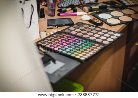 Colorful Eyeshadow Palette. Set Of Multicolored Eye Shadow. Work Desk Of Makeup Artist In The Studio