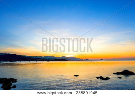 Beautiful Sunset Over Sea And Tropical Beach In Summer Time. Natural Background Of Sunset Dawn And S