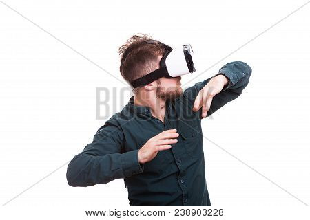 Young Man Experiencing Virtual Reality For The Firts Time. Isolated Over White Background. Studio Ph
