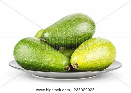Green Smooth Avocado On A Grey Ceramic Plate Isolated On White Background Ripe Shiny Bacon Variety