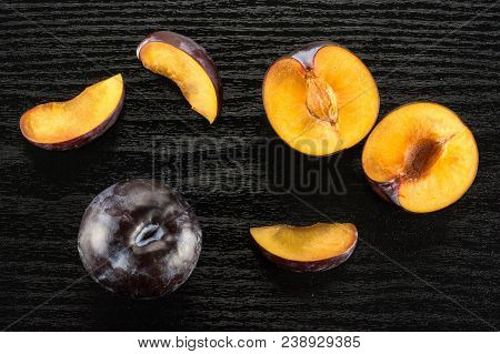 Red Blue Plums Set Table Top Isolated On Black Wood Background One Whole Two Section Halves Three Sl