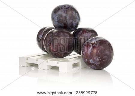 Five Red Blue Plums On A Wood Pallet Isolated On White Background Round Whole Fresh Juicy Fruit