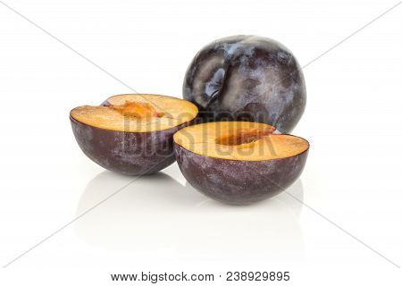 Red Blue Plums One Whole And Two Halves Isolated On White Background
