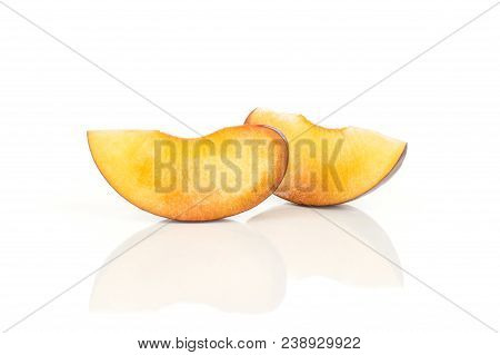 Two Red Blue Plum Slices Isolated On White Background