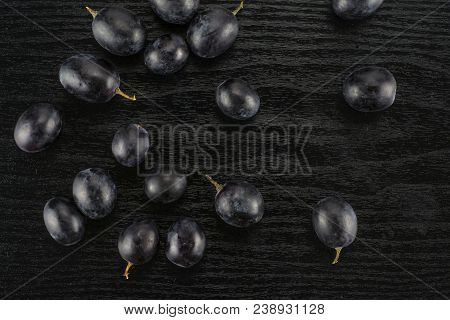 Black Grape Berries (autumn Royal Variety) Table Top Isolated On Black Wood Background