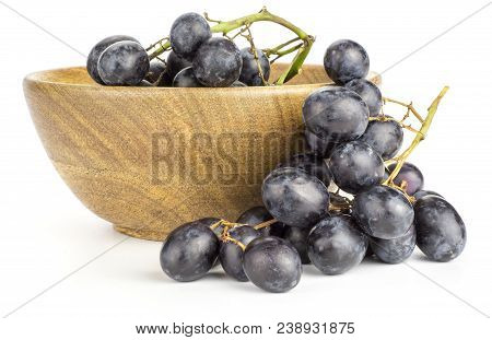 Black Grape Cluster (autumn Royal Variety) In A Wooden Bowl Isolated On White Background