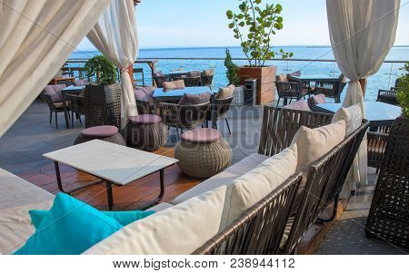 Recreation Area Near Sea. Seaview Restaurant On Shopping Mall Veranda. Seaside Restaurant Interior. 