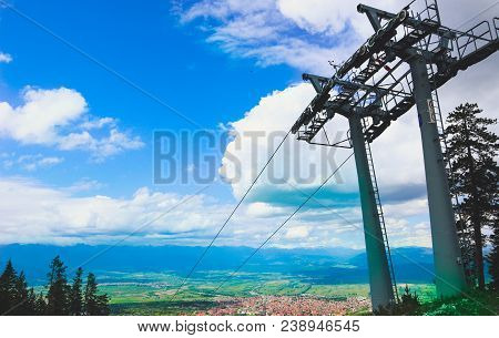 Steel Cable Way Tower Construction, Blue Sky On The Background. Vertical Photo Depicts Mountain Rope