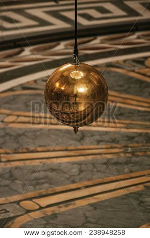 Paris, Northern France - July 12, 2017. Close-up Of The Famous Foucault Pendulum Copper Ball Swingin