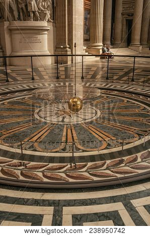 Paris, Northern France - July 12, 2017. View Of The Famous Foucault Pendulum Copper Ball Swinging In
