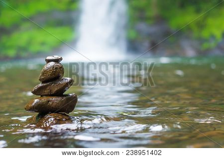 Great Concept Of Spiruality, Tranquility And Meditation, Land Art With Stones In Waterfall.