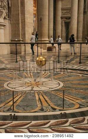 Paris, Northern France - July 12, 2017. View Of The Famous Foucault Pendulum Copper Ball Swinging In