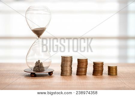 Deadline And Time Is Money Concept With Hourglass
