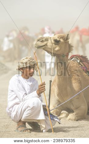 Young Omani Man With His Camel